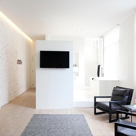 Maison Nationale City Flats & Suites Amberes Habitación foto A room at the hotel